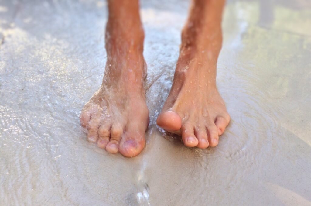 Feet on the sand at the beach